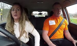 Long-haired MILF blows her car driving instructor